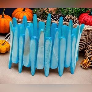 Mother of Pearl shell beaded wide stretch bracelet. Bracelet measures 7” in diam